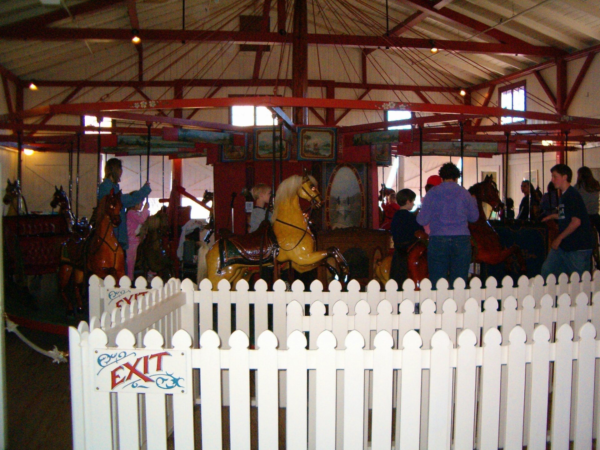 Families enjoying the historic Flying Horses Carousel in Oak Bluffs
